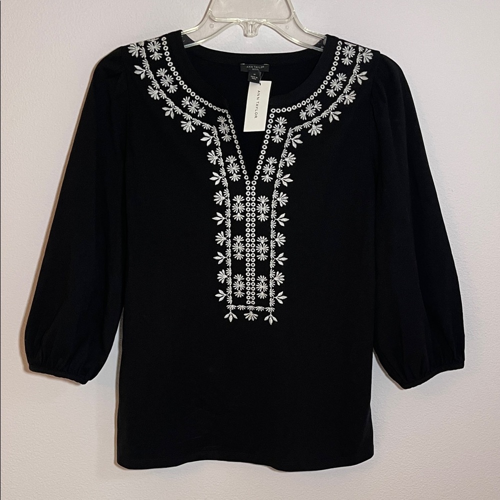 New with tag. Ann Taylor Black Blouse with White Embroidery. Size small petite.